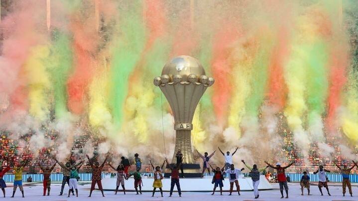 Dancers perform during the opening ceremony of the Africa Cup of Nations (CAN) 2021 football tournament at Stade d&rsquo;Olembé in Yaounde on January 9, 2022. (Photo by Kenzo Tribouillard / AFP)