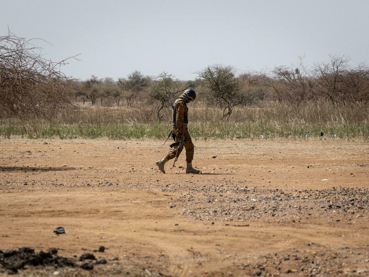 A Burkina Faso soldier patrols at entrance of the Goudebo refugee camp for Malian refugees, in Dori on February 3, 2020. – More than 8 000 Malian refugees live in in the Goudebo refugee camp. (Photo by OLYMPIA DE MAISMONT / AFP) / The erroneous mention[s] appearing in the metadata of this photo by OLYMPIA DE MAISMONT has been modified in AFP systems in the following manner: [A Burkina Faso soldier patrols at entrance of the Goudebo refugee camp for Malian refugees, in Dori on February 3, 2020. More than 8 000 Malian refugees live in in the Goudebo refugee camp.] instead of [A Burkina Faso soldier patrols at a camp sheltering Internally Displaced People (IDP) from Mali in Dori, on February 3, 2020. 600 000 Internally Displaced People (IDP) have fled recent attacks in northern Burkina.]. Please immediately remove the erroneous mention[s] from all your online services and delete it (them) from your servers. If you have been authorized by AFP to distribute it (them) to third parties, please ensure that the same actions are carried out by them. Failure to promptly comply with these instructions will entail liability on your part for any continued or post notification usage. Therefore we thank you very much for all your attention and prompt action. We are sorry for the inconvenience this notification may cause and remain at your disposal for any further information you may require.