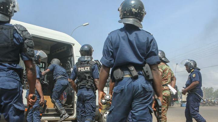 Benin riot officers leave as demonstrators gathered to protest against the current president’s free-market reforms in Cotonou on March 9, 2018. – Police fired teargas to break up an anti-government demonstration by Benin’s political opposition involving thousands of people, according to AFP reporters on the ground. Protesters had gathered in Cotonou, Benin’s economic hub, to march against President Patrice Talon but officers moved in when they strayed off an agreed course. Talon, a former businessman who made his fortune in cotton, was elected in April 2016, and has since tried to revamp the West African nation’s stuttering economy. But his proposals for free-market reform have sparked widespread concern, leading to a series of public sector strikes that have crippled the education, justice and health sector. (Photo by Yanick Folly / AFP)