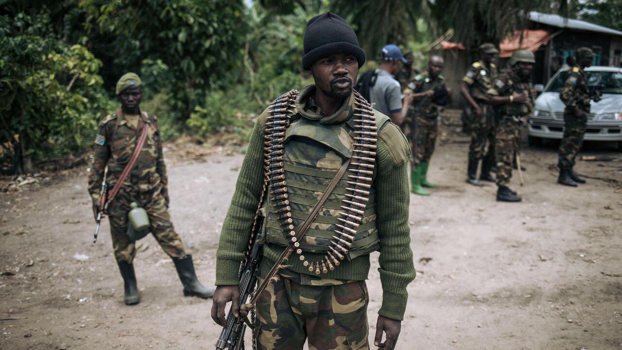 An Armed Forces of the Democratic Republic of Congo (FARDC) soldier takes part in a foot patrol in the village of Manzalaho near Beni on February 18, 2020, following an attack allegedly perpetrated by members of the rebel group Allied Democratic Forces (ADF). (Photo by Alexis Huguet / AFP)