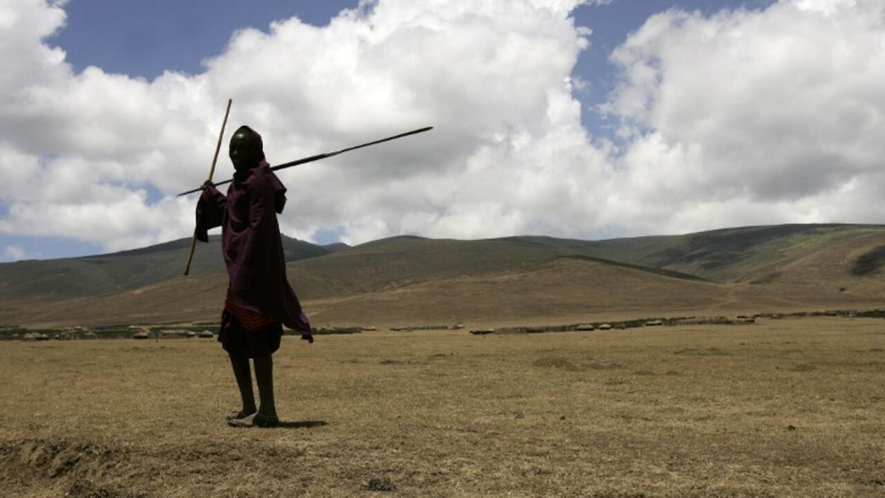 A Massai tribesman walks in the Ngorongoro Conservation Area, northern Tanzania, 26 August 2007. The Ngorongoro Conservation Area (NCA) is a conservation area situated 180 kms west of Arusha in the Crater Highlands area of Tanzania. The area is administered by the NCA Authority, an arm of the Tanzanian government, and its boundaries follow the boundary of the Ngorongoro Division of Ngorongoro District. AFP PHOTO/JOSEPH EID / AFP PHOTO / JOSEPH EID